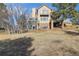 Exterior view of a two-story home with a deck and surrounding yard at 5519 Ponderosa Dr, Parker, CO 80134