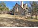 View of home's exterior, highlighting the yard, landscaping, and architectural details at 5519 Ponderosa Dr, Parker, CO 80134