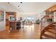 Spacious open-concept kitchen and dining area with hardwood floors, island, and mountain views at 5519 Ponderosa Dr, Parker, CO 80134