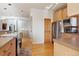 Bright kitchen featuring stainless steel appliances, wood cabinetry, and ample counter space at 5519 Ponderosa Dr, Parker, CO 80134