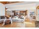 Open-concept living room with spiral staircase and view of the kitchen and dining area at 5519 Ponderosa Dr, Parker, CO 80134