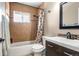Clean bathroom with shower/tub combo and updated vanity at 1065 Modred St, Lafayette, CO 80026