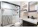 Stylish bathroom with a walk-in shower and floating shelves at 1065 Modred St, Lafayette, CO 80026