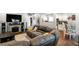 Comfortable living room with a stone fireplace and open floor plan at 1065 Modred St, Lafayette, CO 80026