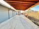 Covered carport with concrete flooring and wooden beams at 4208 S Sherman St, Englewood, CO 80113