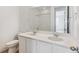 Bathroom boasts double vanity and updated fixtures at 9723 Ceylon St, Commerce City, CO 80022