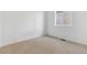 Bright bedroom with carpeted floor and large window at 9723 Ceylon St, Commerce City, CO 80022