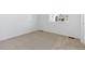 Well-lit bedroom with carpeted floor and window at 9723 Ceylon St, Commerce City, CO 80022