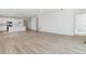 Open concept living room with kitchen view and hardwood floors at 9723 Ceylon St, Commerce City, CO 80022