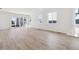 Spacious living room with vinyl plank flooring and access to backyard at 9723 Ceylon St, Commerce City, CO 80022