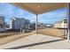 Private patio with backyard view and wooden railing at 9723 Ceylon St, Commerce City, CO 80022