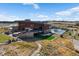 Community clubhouse with pool, outdoor seating and a large lawn area at 3077 Carabiner St, Castle Rock, CO 80108