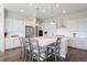 Modern kitchen featuring white cabinets and an island at 3077 Carabiner St, Castle Rock, CO 80108