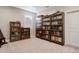 Room with multiple bookcases filled with books at 3077 Carabiner St, Castle Rock, CO 80108