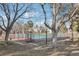 Well maintained tennis court in a tree-lined area at 12615 E Pacific Cir # F, Aurora, CO 80014