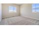 Bright bedroom with neutral walls and carpet at 13873 Bunny Hop Ln, Parker, CO 80134