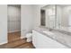Bathroom with granite vanity, toilet and walk-in shower at 2225 Alyssa St, Fort Lupton, CO 80621