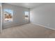 Spacious bedroom with neutral carpeting and large windows at 2225 Alyssa St, Fort Lupton, CO 80621