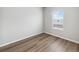 Bright bedroom with neutral walls and vinyl plank flooring at 2225 Alyssa St, Fort Lupton, CO 80621