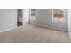 Well-lit bedroom with two windows and neutral carpeting at 2225 Alyssa St, Fort Lupton, CO 80621