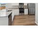 Modern kitchen with stainless steel appliances and granite countertops at 2225 Alyssa St, Fort Lupton, CO 80621