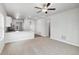 Spacious living room with carpeting and ceiling fan at 2225 Alyssa St, Fort Lupton, CO 80621