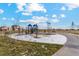 Community playground with play structures and swings at 2225 Alyssa St, Fort Lupton, CO 80621