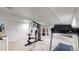 Home gym in basement, featuring weight machine and treadmill at 596 Fox Hunt Cir, Highlands Ranch, CO 80126