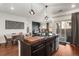 Open concept kitchen with island and dining area at 10226 Worchester St, Commerce City, CO 80022