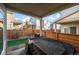 Covered patio with backyard access and grill at 10226 Worchester St, Commerce City, CO 80022