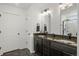 Double vanity bathroom with granite countertops and walk-in shower at 10226 Worchester St, Commerce City, CO 80022