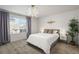 Spacious bedroom with large window, plush carpeting, and modern decor at 10226 Worchester St, Commerce City, CO 80022