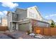 Two-story home with attached garage and modern siding at 10226 Worchester St, Commerce City, CO 80022