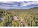 Luxury mountain home with stunning views and expansive grounds at 3864 Valley Dr, Evergreen, CO 80439