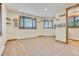 Bright home office with carpet flooring and ample natural light at 3864 Valley Dr, Evergreen, CO 80439