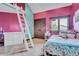 Charming bedroom with built-in storage and colorful decor at 3864 Valley Dr, Evergreen, CO 80439