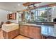 Spacious kitchen with granite countertops and custom wooden cabinetry at 3864 Valley Dr, Evergreen, CO 80439