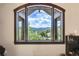 Stunning mountain views seen through a large window at 3864 Valley Dr, Evergreen, CO 80439