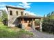 Stone and wood exterior with a deck and mountain views at 3864 Valley Dr, Evergreen, CO 80439