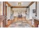Elegant entryway with stone pillars, hardwood floors, and a view to the dining room at 3864 Valley Dr, Evergreen, CO 80439