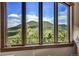 Stunning mountain views seen from large windows at 3864 Valley Dr, Evergreen, CO 80439