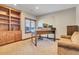 Home office with built-in shelving and window views at 3864 Valley Dr, Evergreen, CO 80439