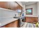 Laundry room with washer, dryer, and ample storage at 3864 Valley Dr, Evergreen, CO 80439