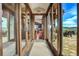 Hallway with glass doors leading to patio and mountain views at 3864 Valley Dr, Evergreen, CO 80439