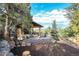 Outdoor pergola with fireplace and mountain views at 3864 Valley Dr, Evergreen, CO 80439
