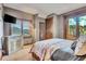 Bedroom with mountain views and private balcony access at 3864 Valley Dr, Evergreen, CO 80439