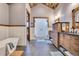 Modern bathroom with double vanity, soaking tub, and hexagon tile at 3864 Valley Dr, Evergreen, CO 80439