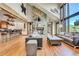 Open kitchen with island, stainless steel appliances, and custom wooden cabinetry at 3864 Valley Dr, Evergreen, CO 80439