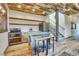Rustic kitchen with custom cabinetry, concrete countertops, and stainless steel appliances at 3864 Valley Dr, Evergreen, CO 80439
