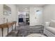 Living room with view of kitchen and entryway at 1098 S Bryant St, Denver, CO 80219